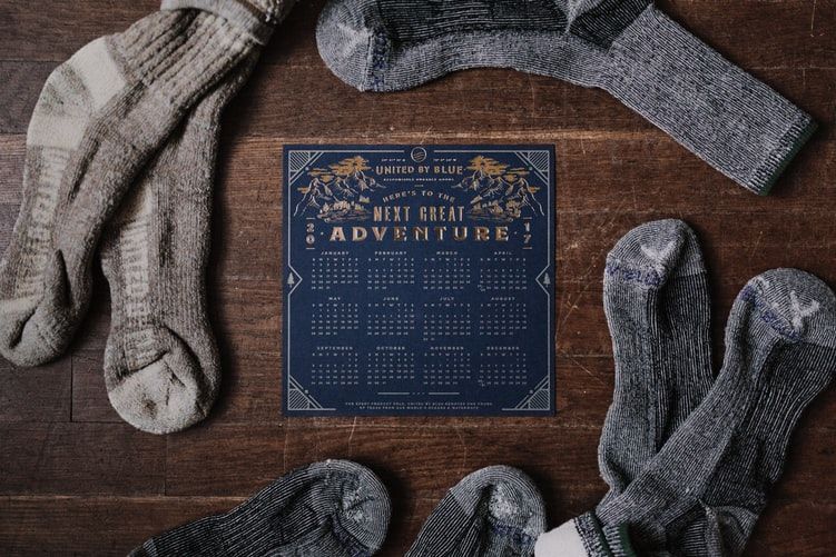 A calendar surrounded by pairs of hiking socks