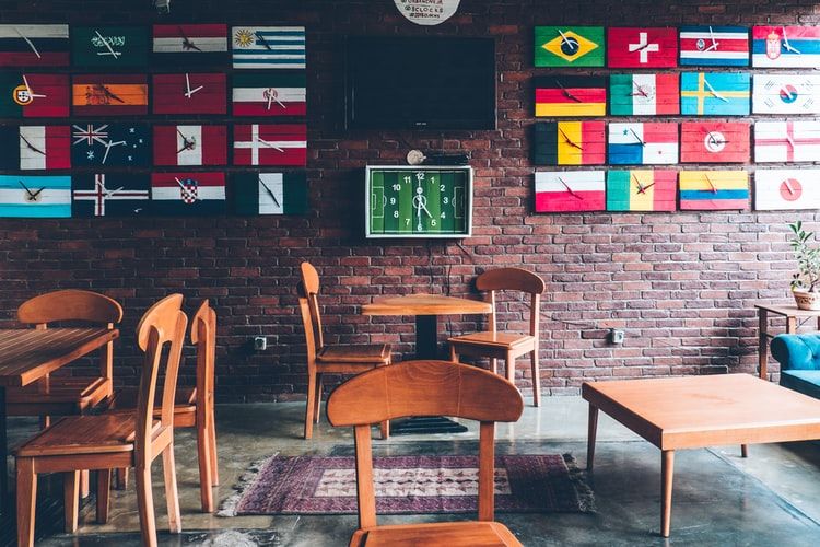 Flags of the world on a wall in a coffee shop