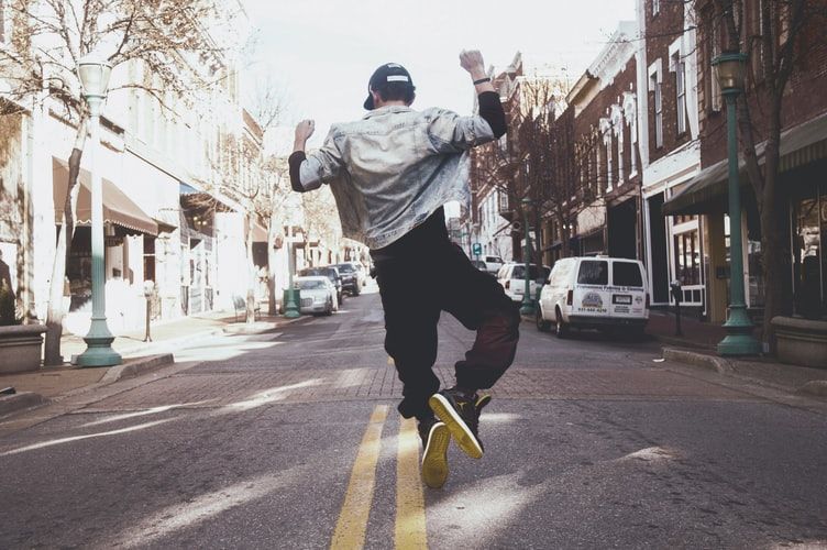 Man jumping for joy in the street