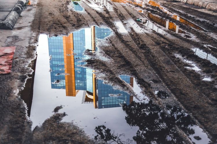 Reflection of skyscrapers in a puddle