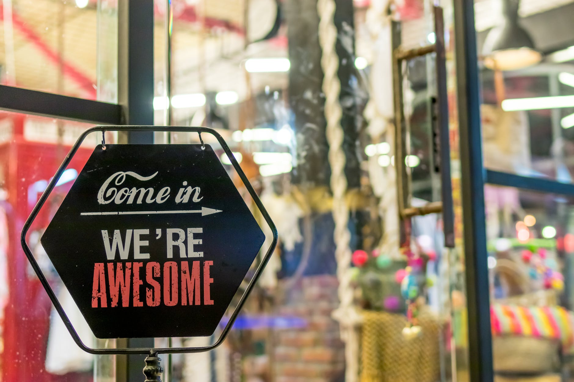 Sign saying 'come in, we're awesome'
