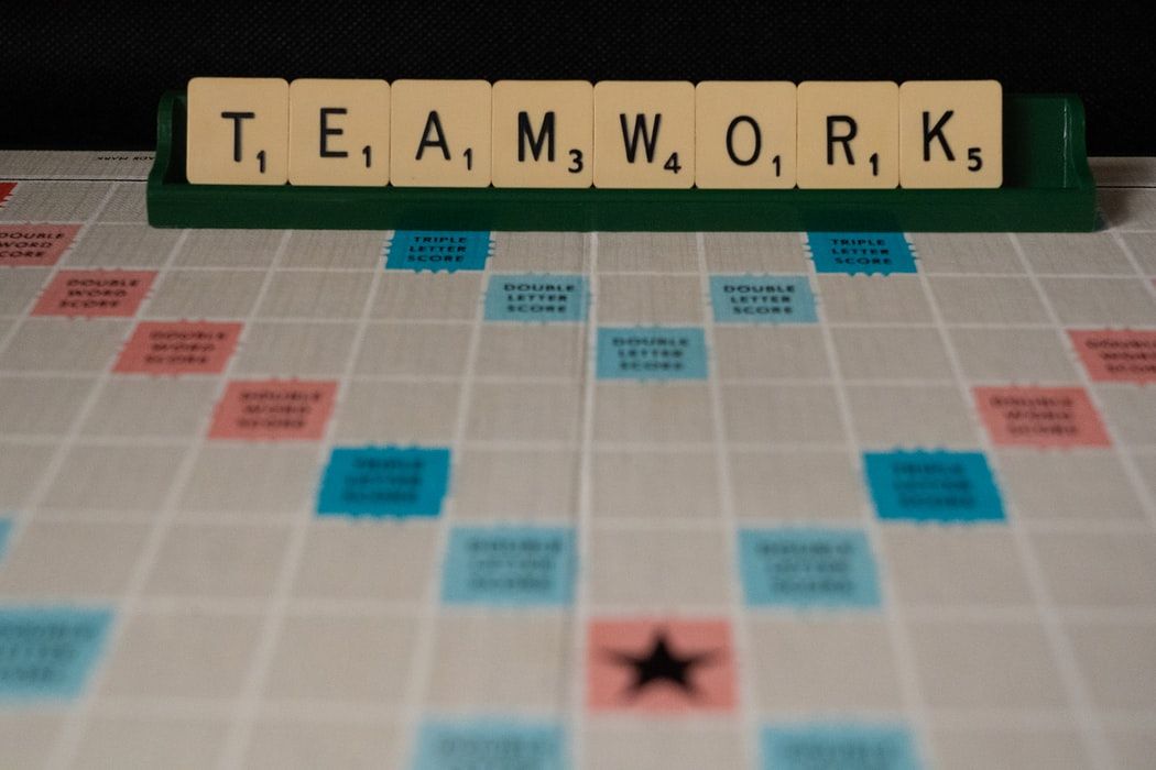 Scrabble tiles spelling out the word 'teamwork' 