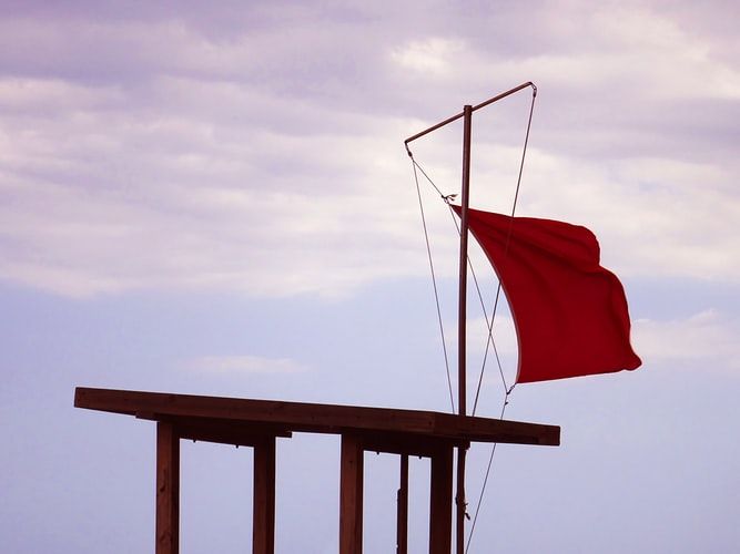 Red flag on a lifeguard's stand