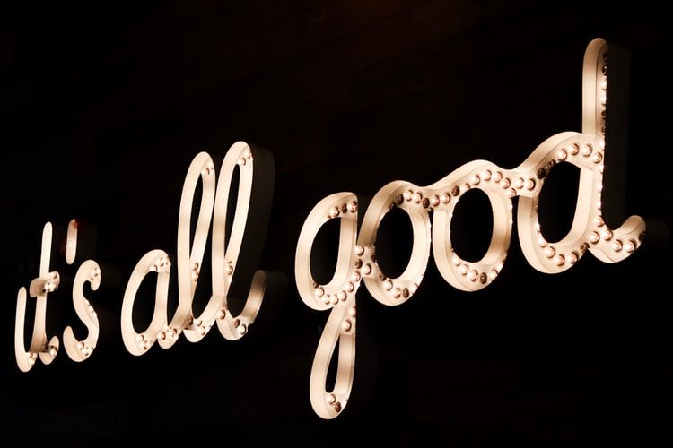 Gold neon sign saying 'it's all good'