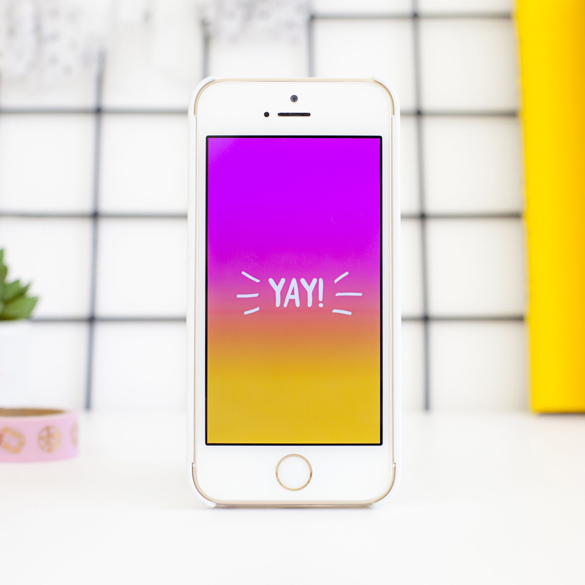 iPhone with the word 'yay' on its screen