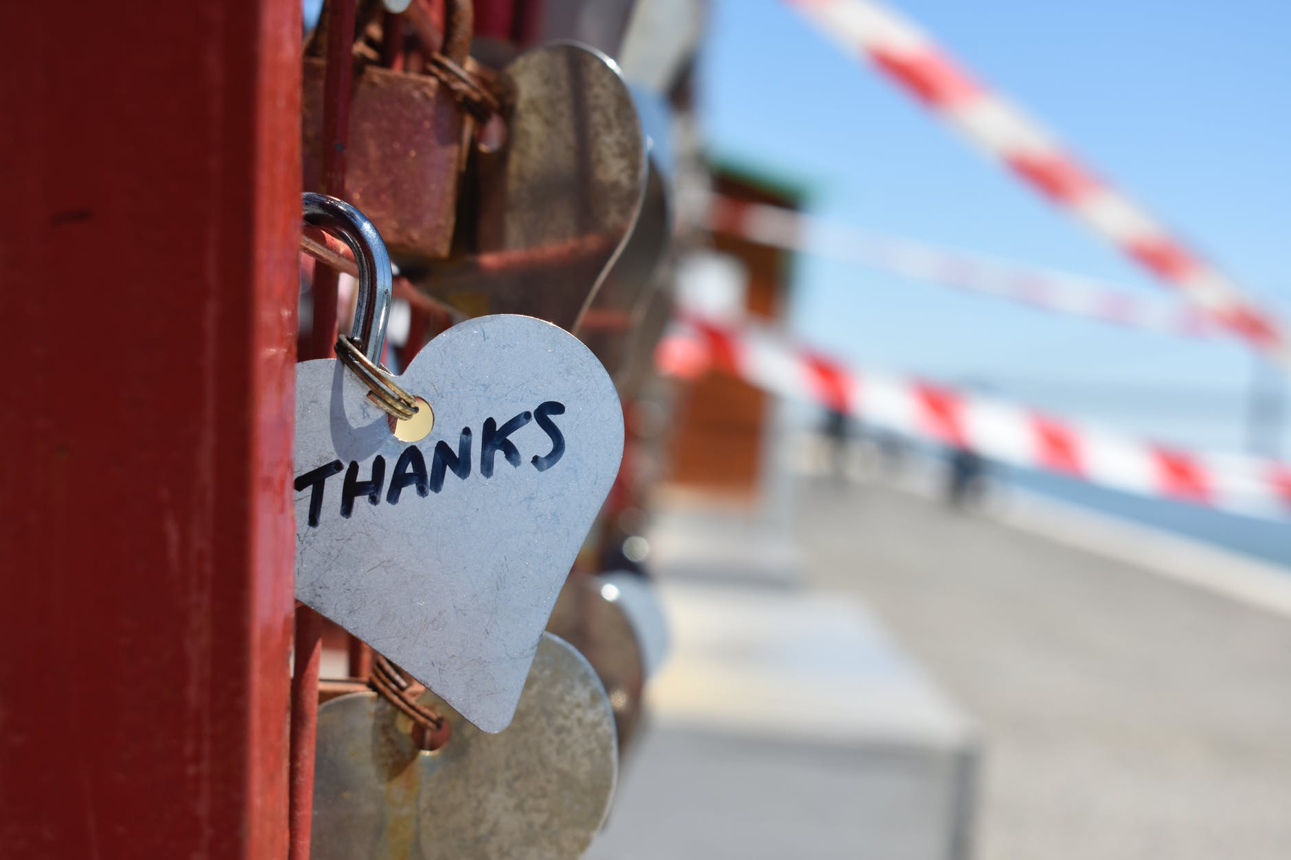 Heart shaped padlock with the word 'thanks' written on it