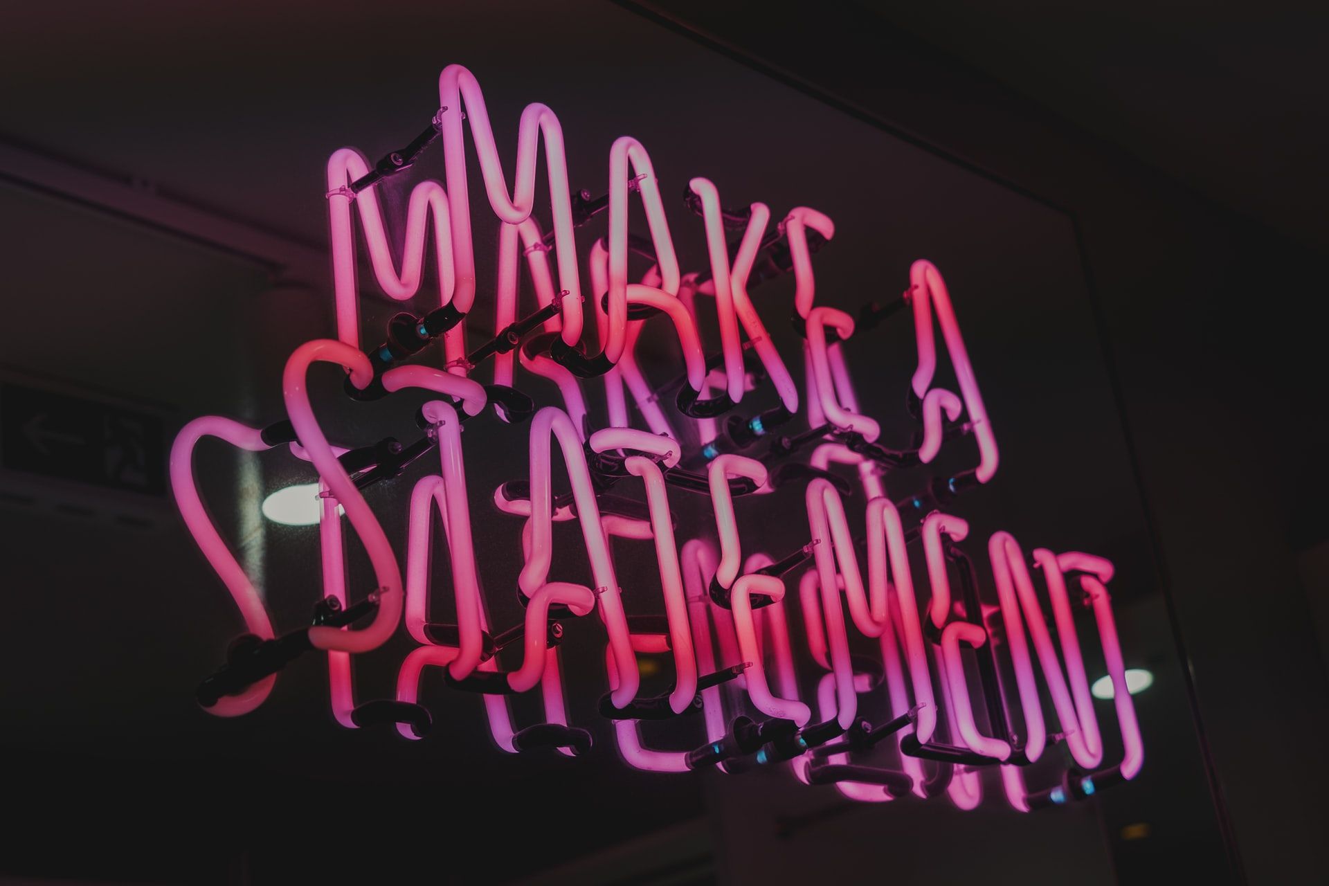 Neon sign saying 'make a statement'