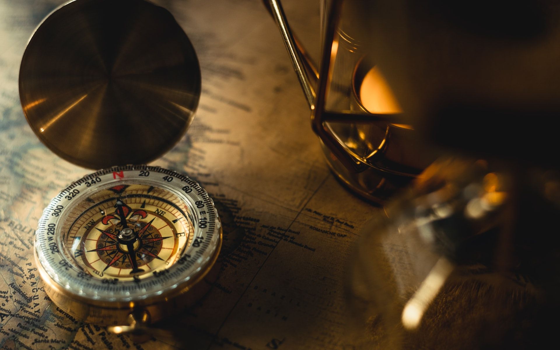 A nautical compass on a map
