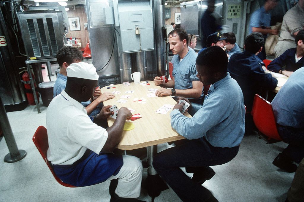 Crew members playing cards in the mess
