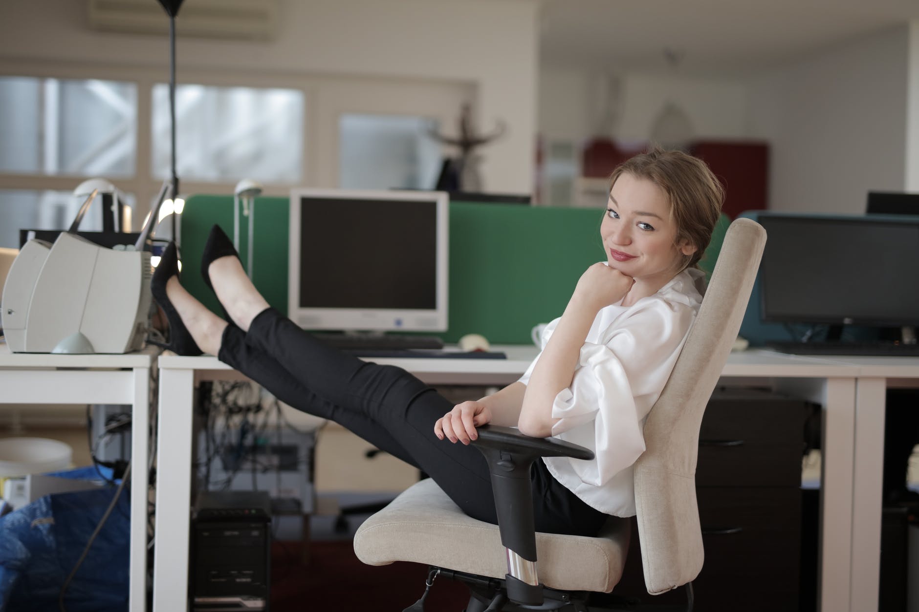 Woman with her feet up on her desk