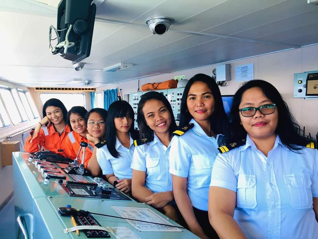 An all female crew on the deck of a ship