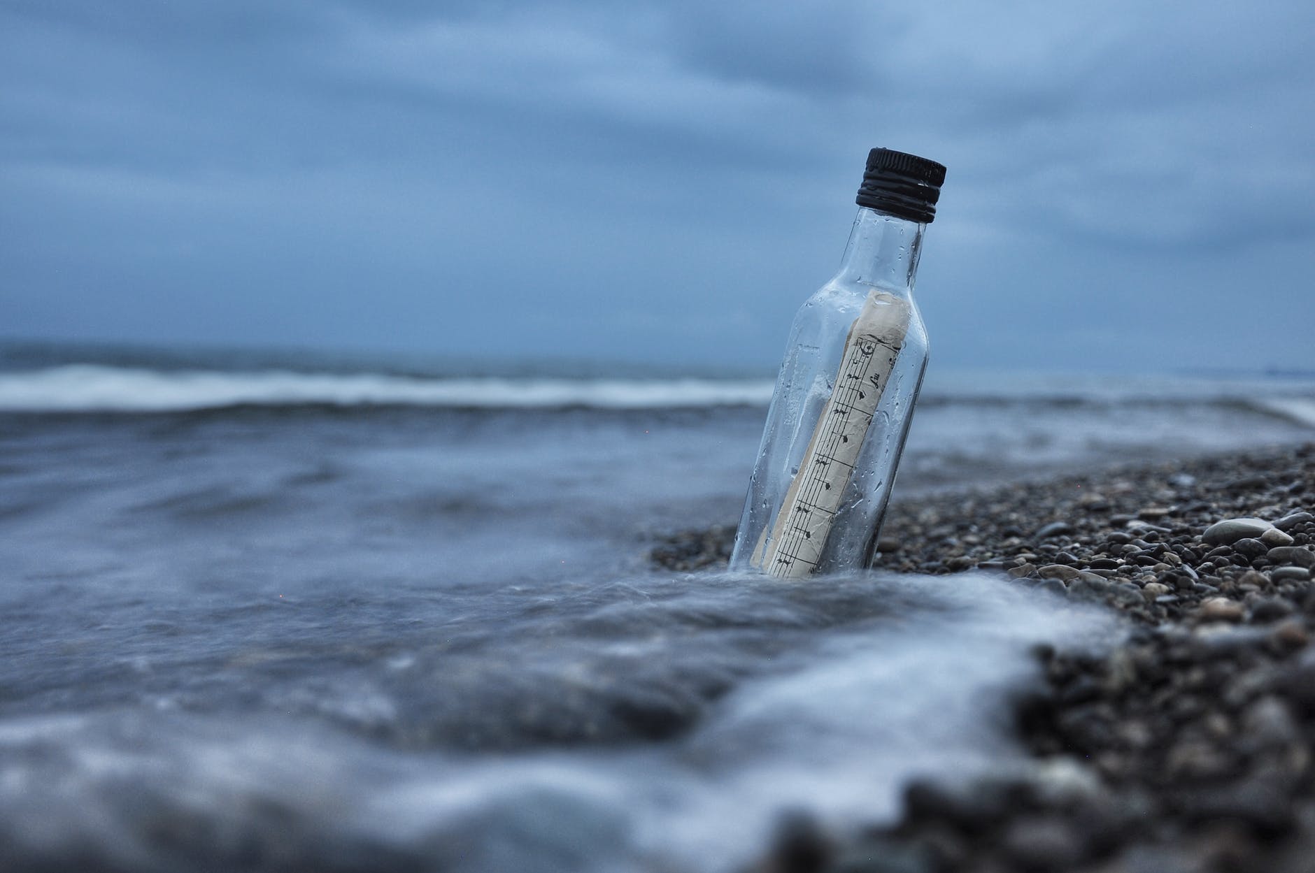 Message in a bottle on a shoreline