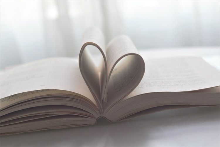 The pages of a book bent into a heart shape
