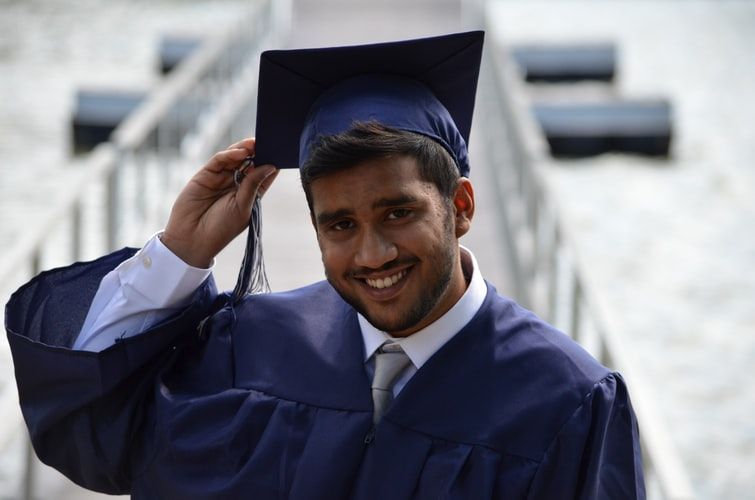 Man wearing graduate cap and gown