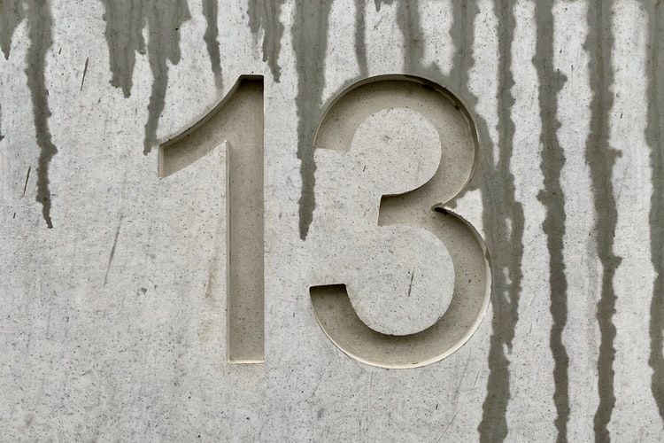 The number 13 carved in cement