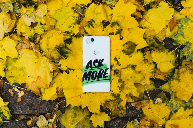 Phone case with 'Ask More' printed on it