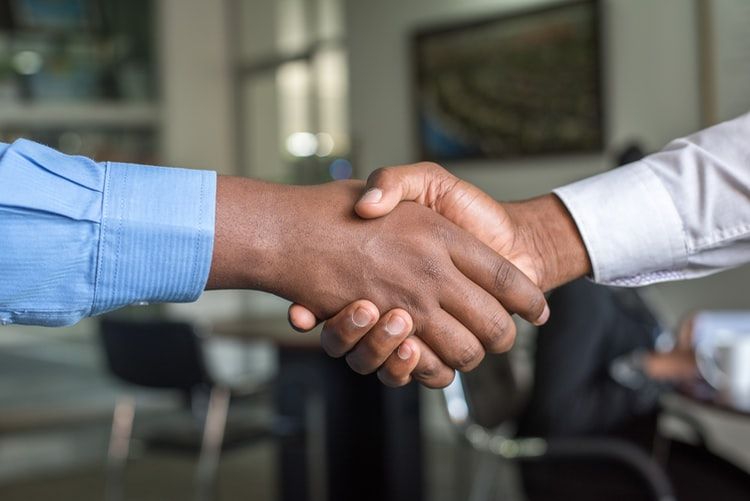 Men in business attire shaking hands