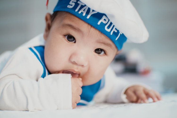 Baby dressed in sailor's outfit