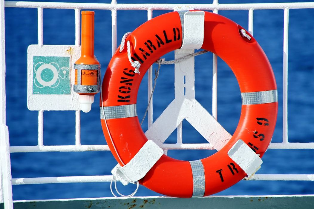 Life buoy on the railings of a boat
