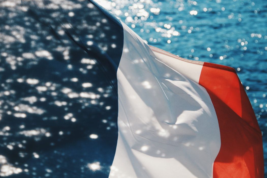 The French flag with water reflections on it