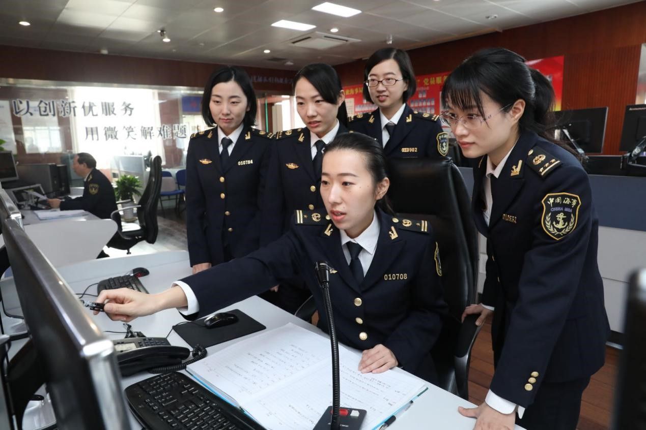 Female maritime professionals working in an office