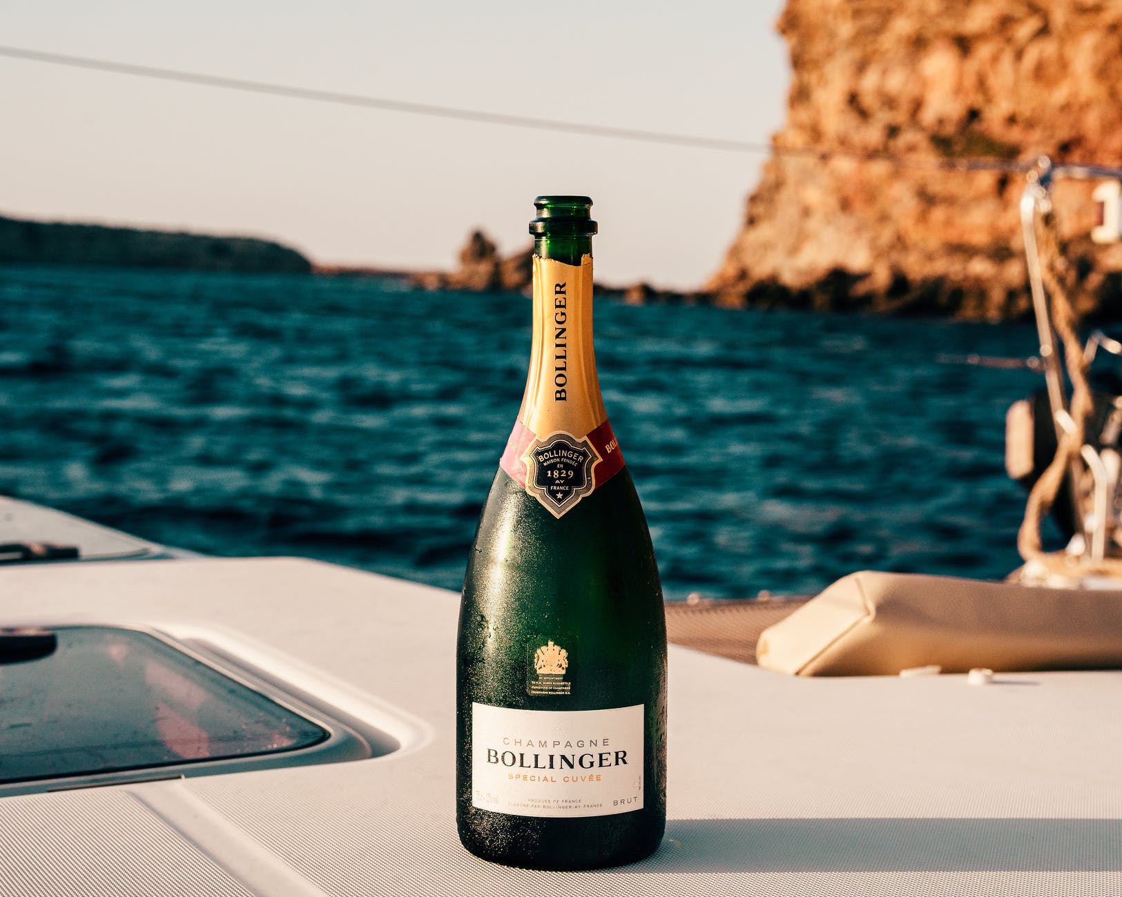 A bottle of Bollinger champagne on the deck of a yacht