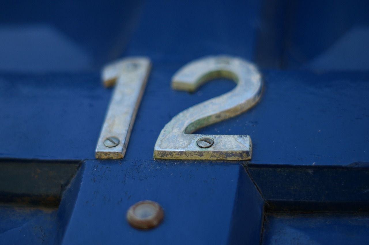 The number 12 on a blue front door