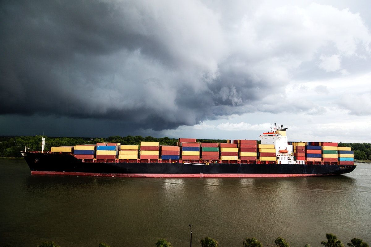 Container ship under stormy skies