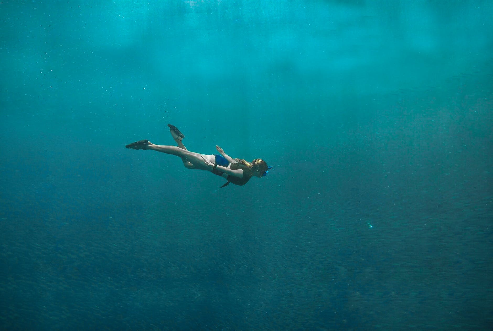 A woman deep sea diving