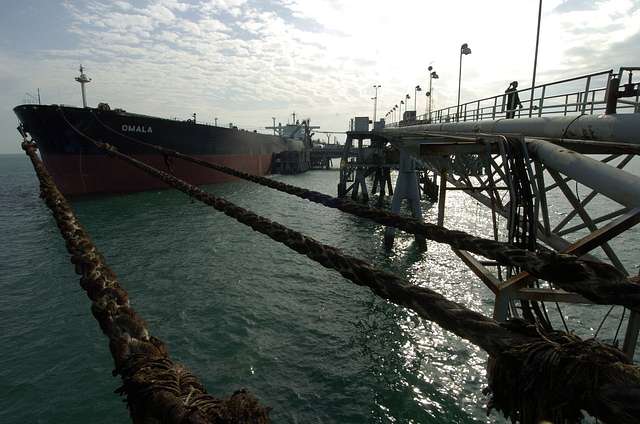 A tanker moored with lines on the dock