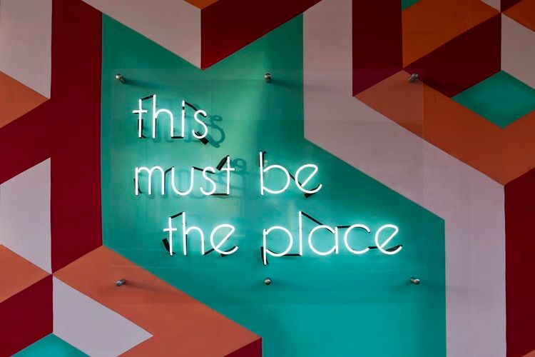 Neon sign saying 'this must be the place'