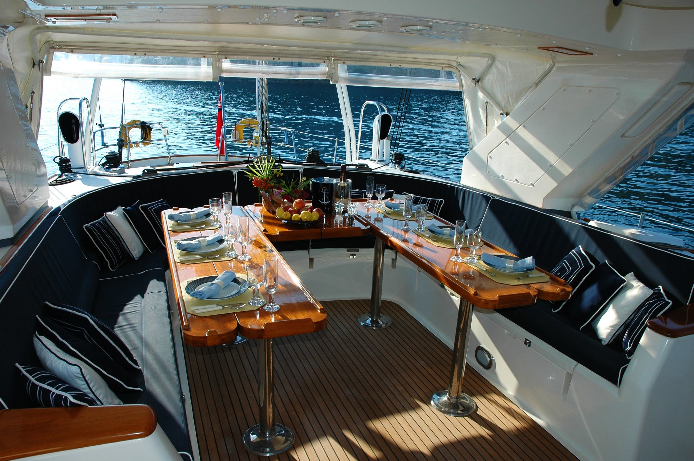 The interior of a superyacht with the table laid for a meal