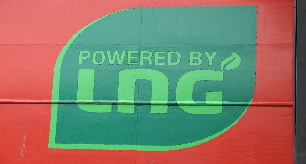 A 'powered by LNG' logo on the side of a vessel