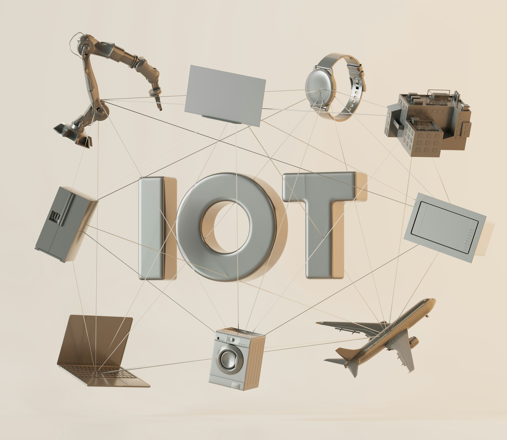 the letters IOT surrounded by various objects such as a laptop, watch and washing machine