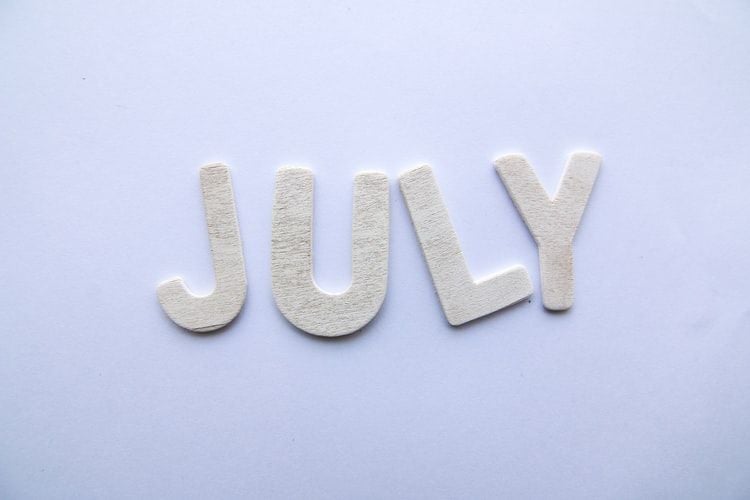 the word July spelt out in felt letters