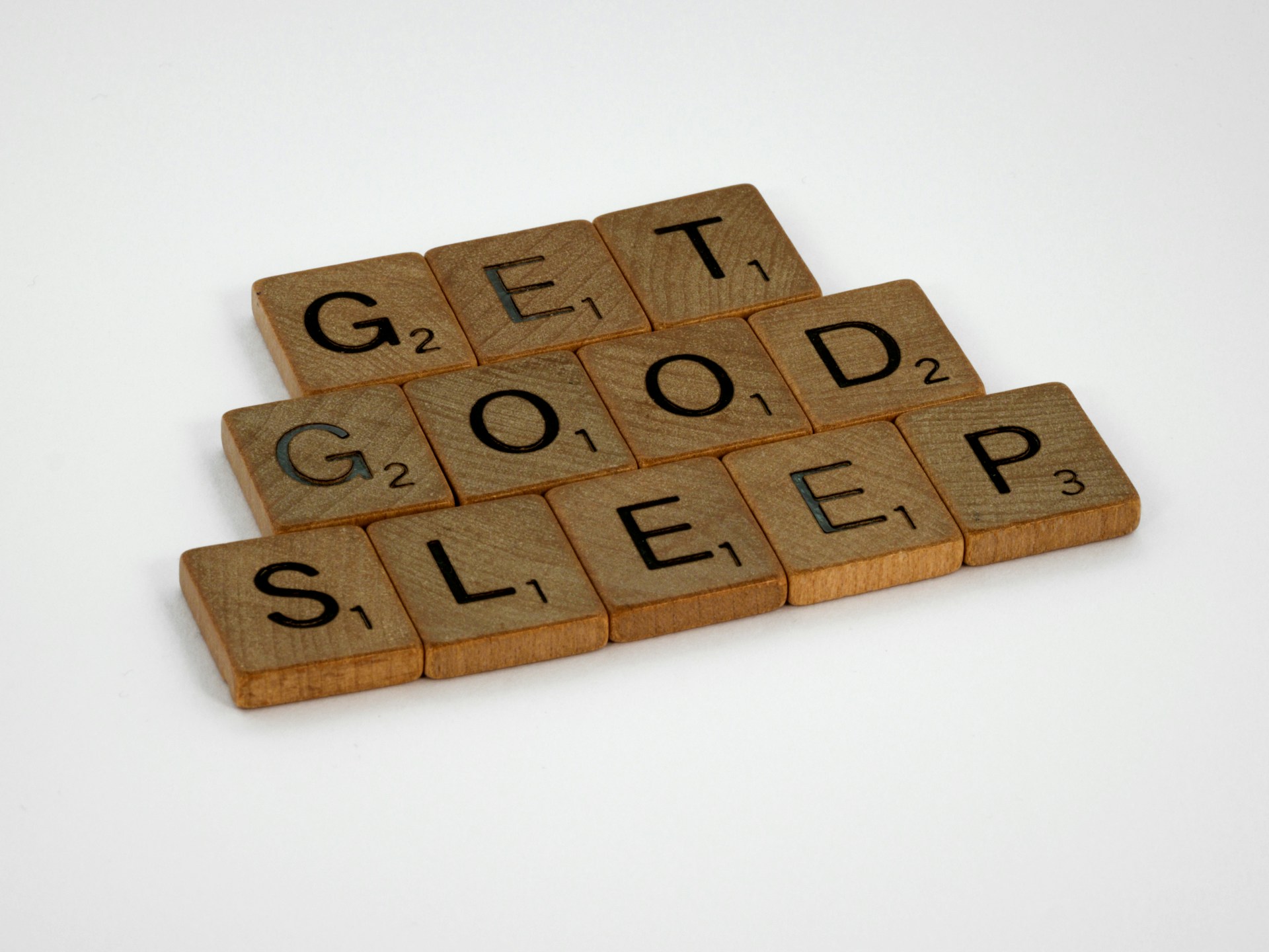 Wooden tiles spelling 'get good sleep'