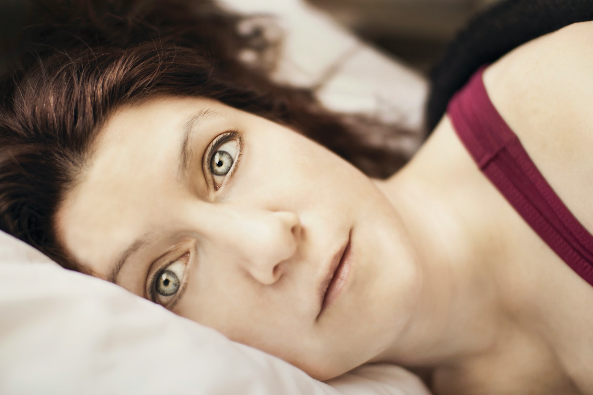 A woman lying wide awake in bed