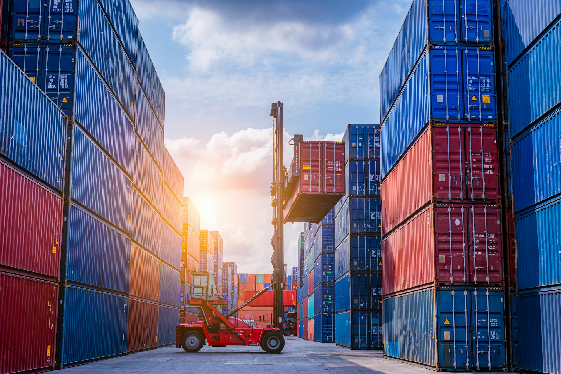 shipping containers and fork lift in a port