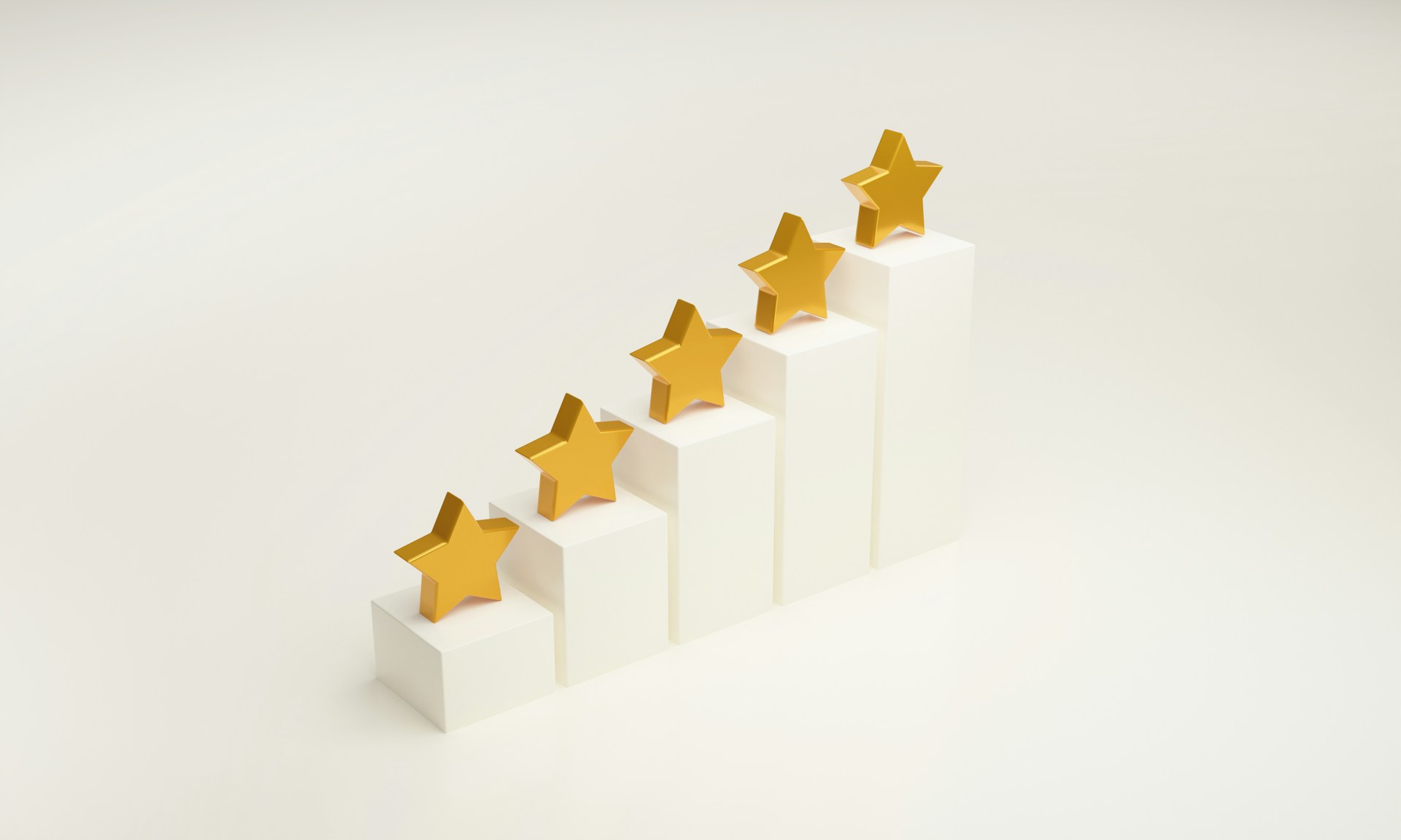 five gold stars on plinths