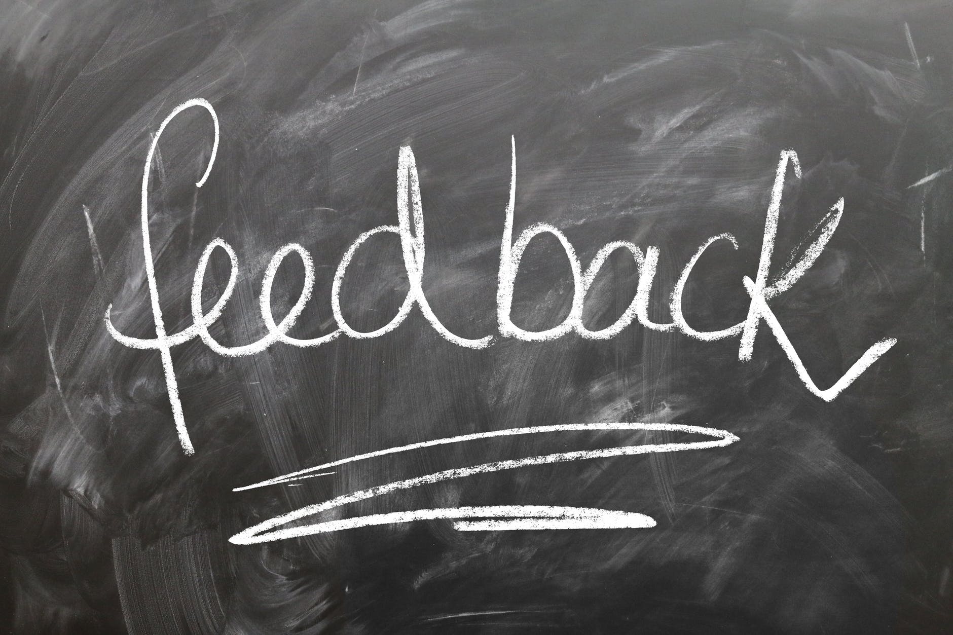 the word 'feedback' written on a chalkboard