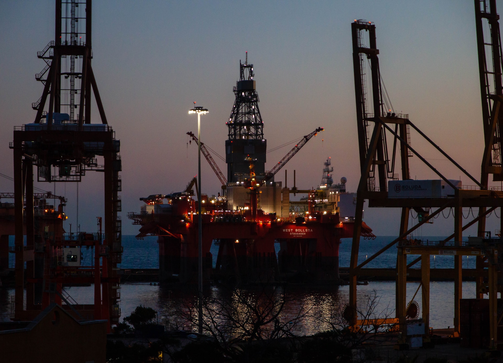 an oil drilling platform at dusk