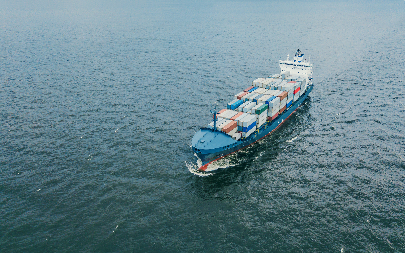 aerial view of a small container ship at sea