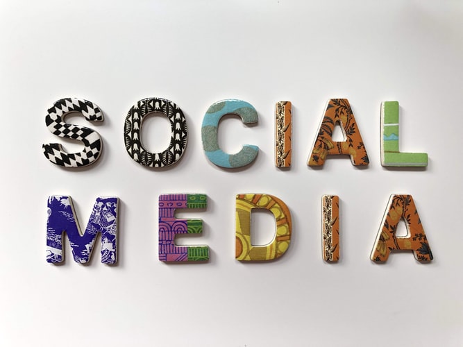 the words 'social media' spelt out with coloured letters