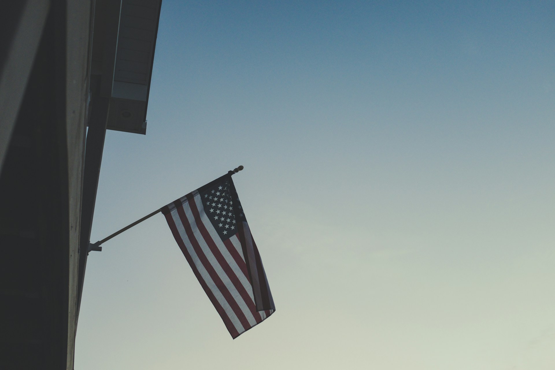 The Stars and Stripes flying from a building