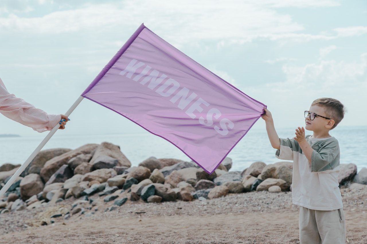 flag with the word kindness 