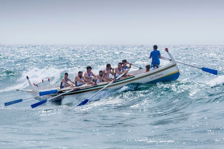 team rowing a boat