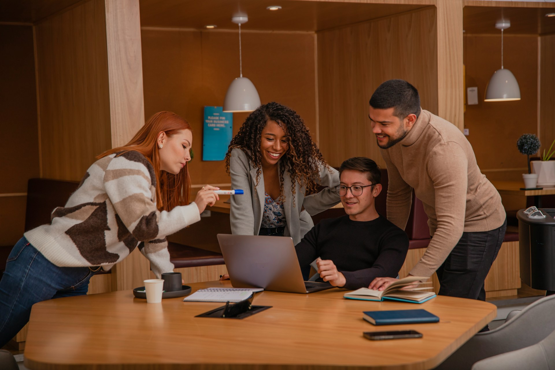 a team looking at a laptop