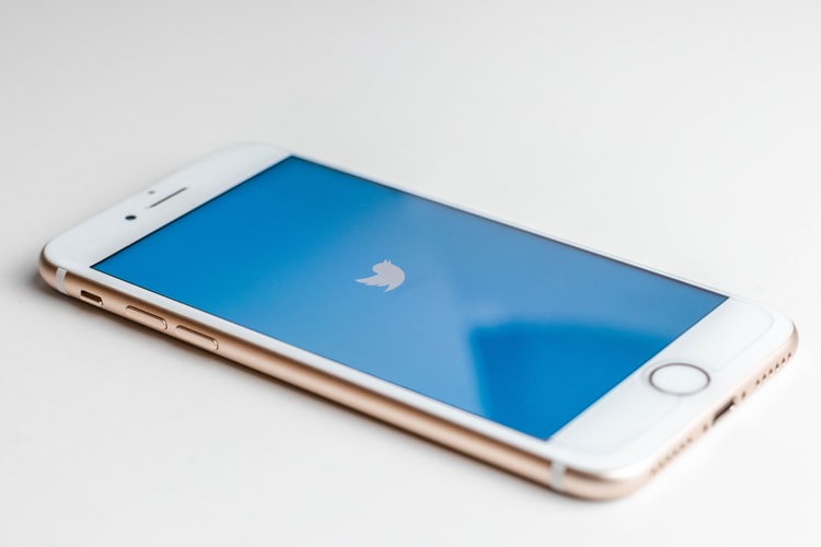 iPhone with the Twitter bird logo on it