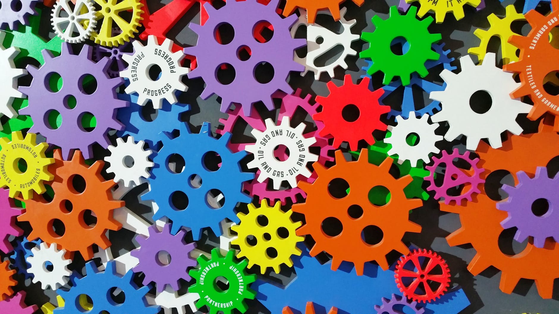 multicolored interconnecting cogs