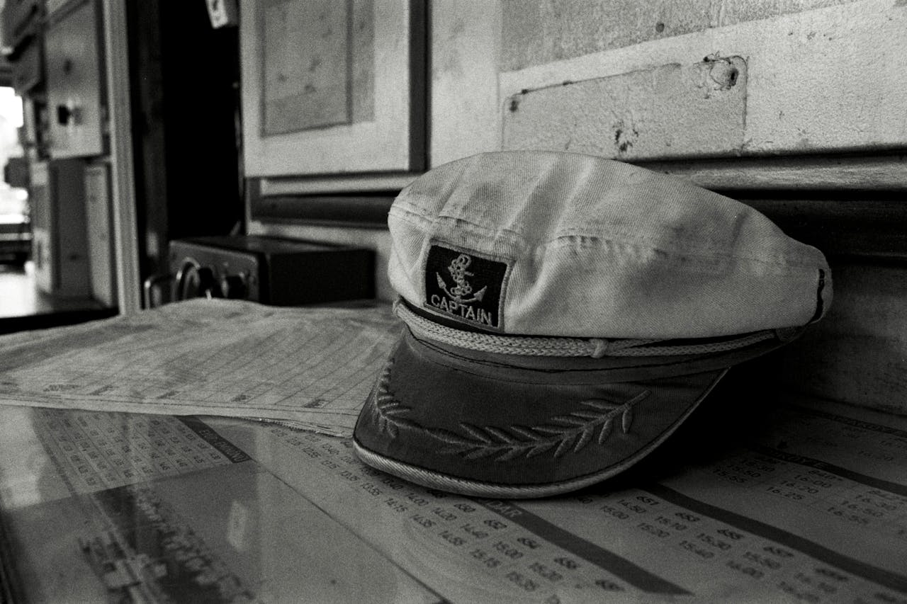 an old captain's cap lying on a table